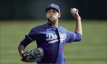  ?? Ross D. Franklin Associated Press ?? DAVID PRICE, shown during a practice, pitched in a game for the first time in a year Monday and did so as a reliever, topping out at 94 mph. The left-hander, who opted out of 2020 because of COVID-19 concerns, has started all but 10 games during his 12-year career.