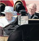  ??  ?? The Queen and the Duke of Edinburgh make their way down The Mall