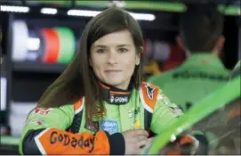  ?? CHRIS KEANE — THE ASSOCIATED PRESS FILE ?? In this file photo, NASCAR driver Danica Patrick waits by her car before auto racing practice at Charlotte Motor Speedway in Concord, N.C.