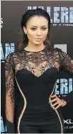  ??  ?? Actress Kat Graham rocks this lacy take on the catsuit.