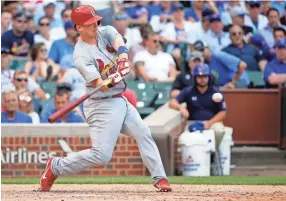  ?? THE ASSOCIATED PRESS ?? Carson Kelly, the No. 3 player in the Cardinals' minor-league system, is one of several talented prospects who were on the opening-day roster for the Memphis Redbirds. the Tigers 400 and 800-meter relay teams set Tennessee standards last weekend. MARK...