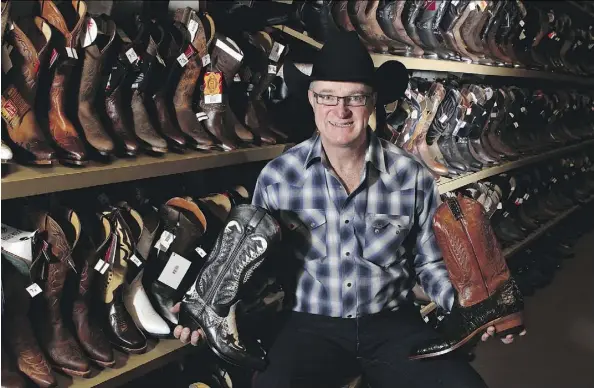  ?? LEAH HENNEL/FILES ?? Brian Guichon, owner of Riley & McCormick with some of the many boots at his store on Stephen Avenue in downtown Calgary.