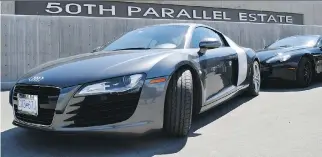  ?? STEVE MACNAULL ?? The Audi R8 and Aston Martin Vantage Spyder take a rest at the 50th Parallel Estate Winery.