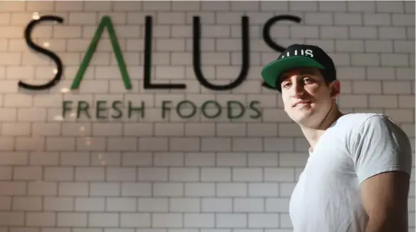  ?? STEVE RUSSELL PHOTOS/TORONTO STAR ?? Adam Spagnuolo is the owner of Salus Fresh Foods, which specialize­s in supersized and healthy salads, wraps and smoothies. It is a new health-conscious restaurant located at 25 Carlton St.