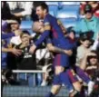  ?? THE ASSOCIATED PRESS ?? Barcelona’s Aleix Vidal celebrates with Lionel Messi, right, after scoring his side’s third goal during the Spanish La Liga match between Real Madrid and Barcelona.