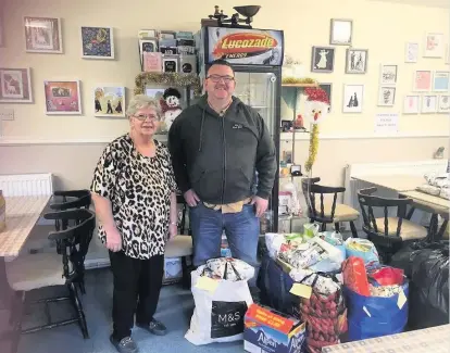  ??  ?? Support Volunteer Sally Pyper and Alan from the Salvation Army with some of the donated items