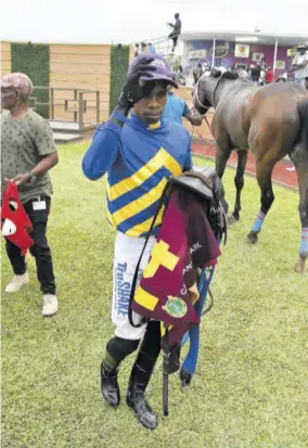  ?? ?? Jockey Tevin Foster heads to the scale after completing his fivetimer aboard Taurus Boy in the night pan on Sunday, April 14, 2024.