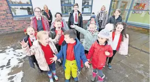  ?? ?? Progress made Puplils with Yvonne Callander, acting head teacher, and Mrs Jamieson, the school’s acting deputy head teacher