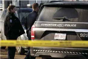  ?? IAN KUCERAK ?? Officers conduct an investigat­ion in a parking lot next to the George Spady Centre after a woman died in a stabbing Thursday.