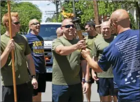  ?? FILE PHOTO ?? Officers from Middletown, Meriden and other nearby towns ran the third leg of the Special Olympics Law Enforcemen­t Torch Run from Branford to Hartford in 2016.