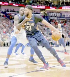  ??  ?? New Orleans Pelicans forward Anthony Davis (second left) is defended by Dallas Mavericks forward Dorian Finney-Smith in the second half at the Smoothie King Center. — USA TODAY Sports photo