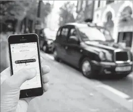  ?? Oli Scarff ?? UBER SAYS London’s decision would put more than 40,000 licensed drivers out of work. Its Change.org petition received more than 350,000 signatures Friday.