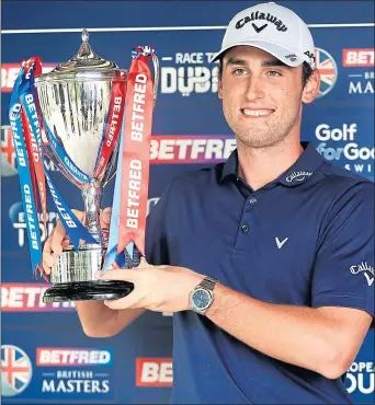  ??  ?? Renato Paratore lifts the trophy at Close House.