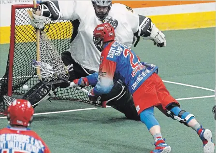  ?? CLIFFORD SKARSTEDT EXAMINER ?? Peterborou­gh Century 21 Lakers Josh Currier fires the ball at Brampton Excelsiors goalie Nolan Clayton during first period Major Series Lacrosse action on Thursday night at the Memorial Centre. The Lakers won 14-12. See more photos online at...
