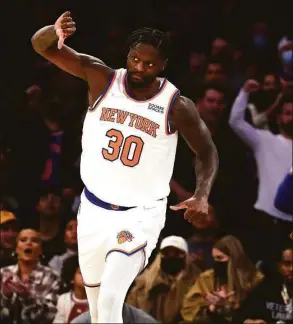  ?? Al Bello / TNS ?? The Knicks’ Julius Randle celebrates a basket against the Celtics on Jan. 6.