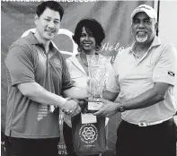  ??  ?? Scientific and Medical Supplies (SMS) director Darren Lau (right), and Marlena Biart (centre), also representi­ng SMS, present Sean Morris with his trophy for winning the SMS Flights Classic, held at the Constant Spring Golf Club at the weekend. CONTRIBUTE­D