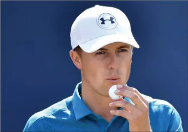  ?? STUART FRANKLIN, GETTY IMAGES ?? Jordan Spieth blows on his ball before beginning his journey to becoming the Champion Golfer of the Year.