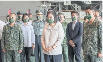  ?? REUTERS ?? President Tsai Ing-wen visits pilots ahead of National Day celebratio­ns at an air base in Taipei yesterday.