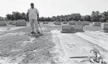  ?? Gerry Broome / Associated Press ?? Larry Monk overlooks the spot where his father was buried at Elmwood Cemetery in Goldsboro, N.C. Flooding unearthed his father’s vault in 2016.