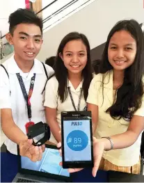  ?? SUNSTAR FOTO / ARNI ACLAO ?? YOUNG INVENTORS. (From left) John Ronnel Hora, Krisha Bernadette Suico and Gwyneth Caryl Seciban of the Philippine Science High School present their invention during the Robotics Cup held in SM Seaside City Cebu.