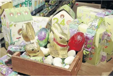  ?? Picture: Sebabatso Mosamo ?? A variety of chocolate treats in the shape of eggs and bunnies are arranged for display at the Woolworth store in Sandton City ahead of the Easter holidays.