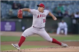 ?? PHOTOS BY JEFF CHIU — THE ASSOCIATED PRESS ?? Angels starter Jose Suarez pitched seven shutout innings at Oakland on Monday night, holding the A’s to two hits and striking out eight to pick up the victory.