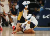  ?? Tribune News Service/bay Area News Group ?? Golden State Warriors’ Stephen Curry (30) hits the floor after being fouled by the Memphis Grizzlies in the first quarter of Game 2 of an NBA basketball second-round Western Conference playoff series at the Fedex Forum.