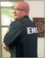  ?? EVAN BRANDT — DIGITAL FIRST MEDIA ?? Goodwill Ambulance EMT Erik Loshnowsky with one of the new bulletproo­f vests now being used.