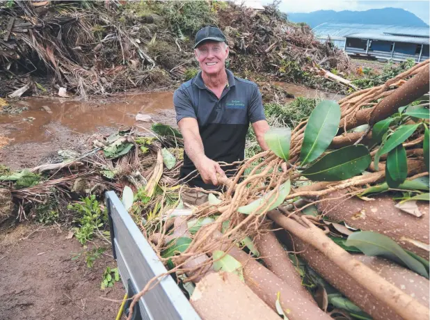  ?? Picture: STEWART McLEAN ?? STORM READY: Arborist Roger Oliver dumps green waste at the Portsmith transfer station in preparatio­n for potential cyclones.