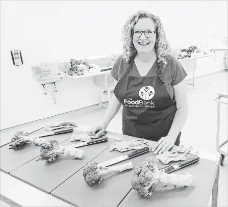  ?? MATHEW MCCARTHY WATERLOO REGION RECORD FILE PHOTO ?? Wendi Campbell of the Food Bank of Waterloo Region shows off the Fresh Approaches Food Centre at the Kitchener office earlier this year.