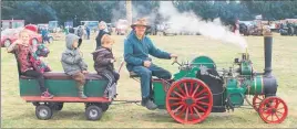  ??  ?? LITTLE ‘UN: This model traction engine carrying passengers had four much bigger ‘parents’ on display.