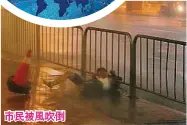  ??  ?? 納沙颱風風勢強勁，台北市一名男子被暴風­吹倒。（路透社照片）市民被風吹倒