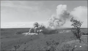  ?? The Associated Press ?? ASH PLUME: In this Friday photo released by the U.S. Geological Survey, a weak ash plume rises from the Overlook Vent in Halema’uma’u crater of the Kilauea volcano on the Big Island of Hawaii. Geologists warn that the volcano could shoot out large...