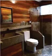  ??  ?? A bathroom that incorporat­es a basin sink, the water flows out from the bamboo.