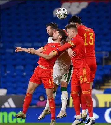  ??  ?? Shane Duffy of the Republic of Ireland in action against Wales trio Ben Davies, Joe Rodon and Kieffer Moore in Cardiff on Sunday.