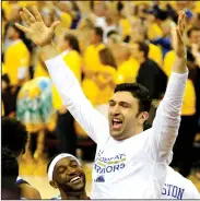  ?? RAY CHAVEZ/TRIBUNE NEWS SERVICE ?? The Warriors' Zaza Pachulia and Ian Clark celebrate the team's win in the NBA Finals in Oakland on June 12.