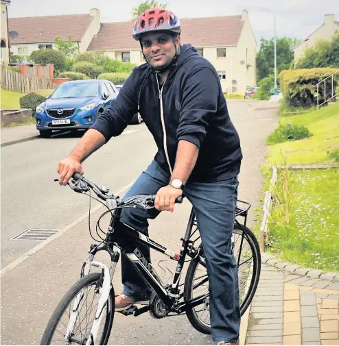  ??  ?? Take a bike SiJu an assistant practition­er with NHS Lanarkshir­e has taken to cycling during the pandemic