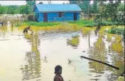  ?? PHOTO ?? An agricultur­al farmer’s house was completely submerged in the flood waters at Udaipur in Tripura’s Gomati district on Sunday.HT