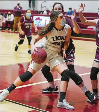  ?? DANA JENSEN/THE DAY ?? Wheeler’s Molly Butremovic (20) drives to the basket against Killingly’s Madelyn Sumner (24) during Friday night’s game at Wheeler. The Lions, playing their first home game of the season due to COVID-19 pauses, fell short 49-39.