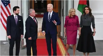  ?? — AFP photo ?? (From left) Crown Prince Al Hussein, King Abdullah II, Biden, First Lady Jill Biden and Queen Rania Al Abdullah stand for photos during an arrival ceremony at the White House in Washington, DC.