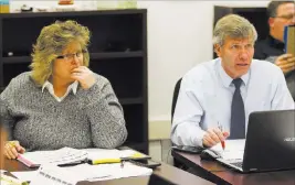  ?? Erik Verduzco ?? Las Vegas Review-journal Pamela Sloan, CCSD director of athletics, and Bart Thompson, NIAA executive director, head up a Dec. 7 class realignmen­t meeting at Chaparral High.