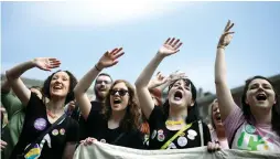  ?? (Clodagh Kilcoyne/Reuters) ?? WOMEN CELEBRATE the outcome of Friday’s referendum to liberalize Ireland’s abortion law, yesterday in Dublin.