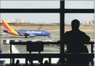  ?? Associated Press ?? A Southwest Airlines jet on the runway at LaGuardia Airport on Friday. The Federal Aviation Administra­tion reported delays in air travel Friday because of a “slight increase in sick leave” at two East Coast air traffic control facilities. Travelers endured widespread flight delays in the Northeast. LaGuardia in New York and Newark Liberty Internatio­nal Airport in New Jersey were the hardest hit.