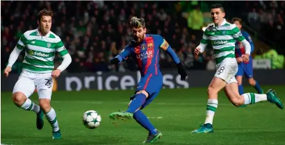  ?? AFP ?? Barcelona’s striker Lionel Messi (centre) scores the opening goal against Celtic in the Champions League match on Wednesday. —