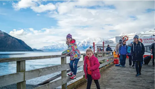  ??  ?? ABOVE / Learn something new on a Mt Nicholas farm tour regardless of age. RIGHT / The Queenstown waterfront is a beautiful place with plenty on offer day and night. PREVIOUS
PAGE / The Remarkable­s is just one of four ski fields within 90 minutes of Queenstown.