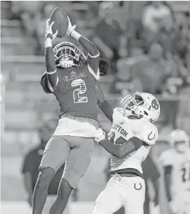  ?? Karen Warren / Houston Chronicle ?? New Caney’s Dwight McGlothern made numerous plays on both sides of the ball in the win over Dayton, with two touchdown receptions and an intercepti­on.