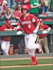  ?? Crant Osborne/Special to the News-Times ?? Coming home: Arkansas' Eric Cole trots home after hitting a home run against Kentucky during an SEC series earlier this season in Fayettevil­le. Arkansas opens a three-game series tonight at Baum Stadium against South Carolina.