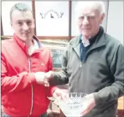  ?? ?? Winner Richie Carey, accepting his prize from captain Jason O’Dwyer.