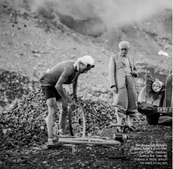  ?? ?? Belgian rider Sylvère Maes fixes a puncture on the Col du Galibier during the Tour de France in 1939, which he went on to win