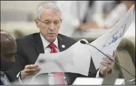  ?? ASSOCIATED PRESS FILES ?? State Rep. John Szoka, of Fayettevil­le, looks over a redistrict­ing map during a 2019 committee meeting at the Legislativ­e Office Building in Raleigh, N.C. After lawsuits alleging racial gerrymande­ring, Republican­s drawing legislativ­e redistrict­ing maps in Texas, Ohio and North Carolina this year say they won’t use racial or partisan data in making their determinat­ions.